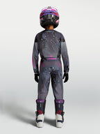 Alpinestars 2027 Youth Fluid Lone Jersey and pants, gray camo and purple motocross gear, rear view on rider.