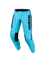Alpinestars 2026 Woman Stella Fluid Apex Pants, Motocross Pants, Bright Cyan Blue and Black, featuring bold black branding on the thighs, black inner knee patches, and a ratchet waist closure, ergonomic design for female off-road riders.