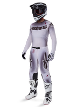 Motocross rider wearing 2025 Supertech Maker Pants in Silver Black, coordinated with a matching silver and grey jersey, black and white helmet, and white racing boots, featuring technical athletic fit for professional off-road performance.