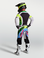 Alpinestars Supertech Dyna Jersey and Gear Set, men's motocross gear in green fluo and lilac, rear view.