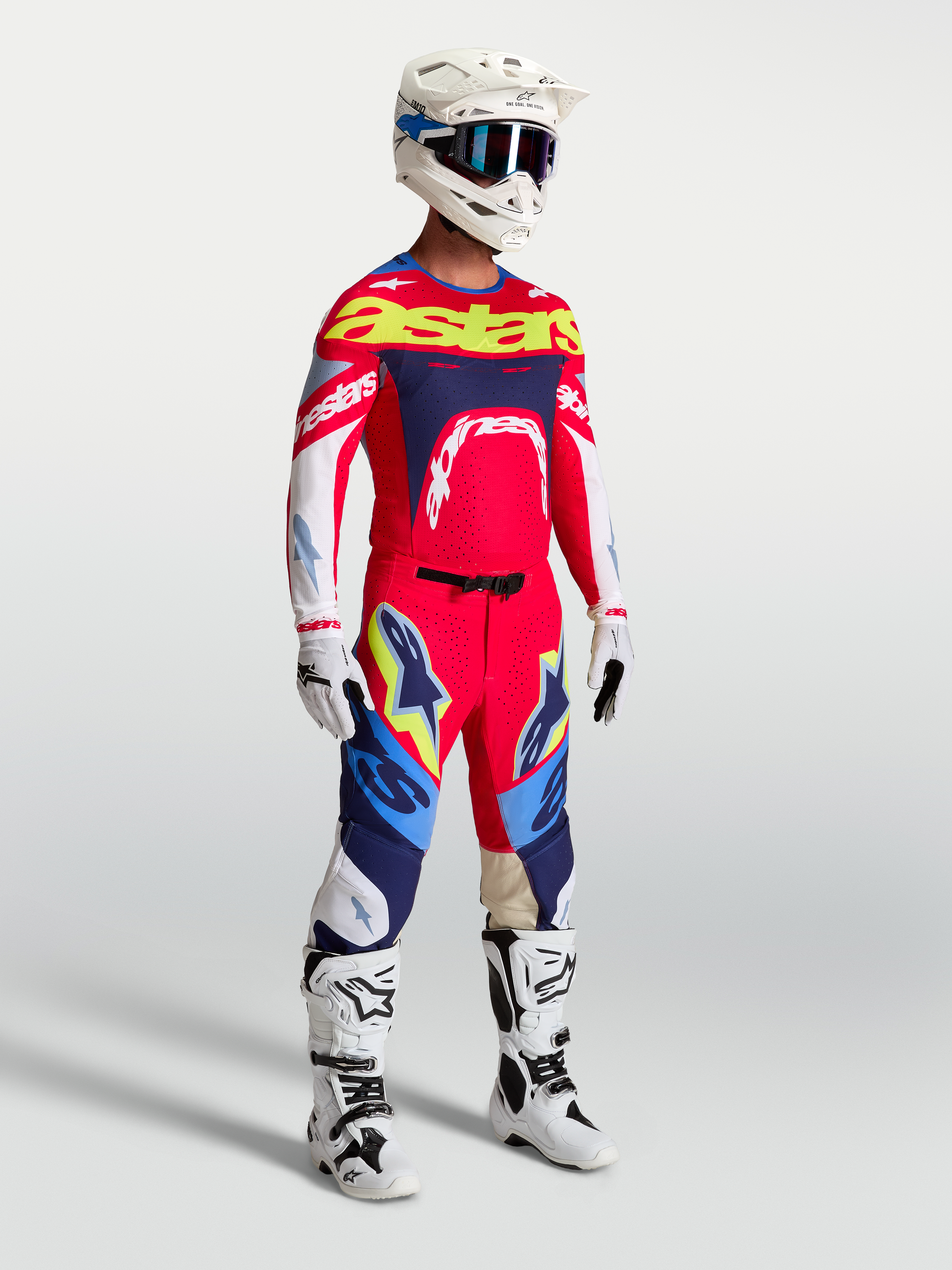 Alpinestars Supertech Dyna Jersey in fire red and navy blue, a pro-level athletic motocross gear set for racing performance.