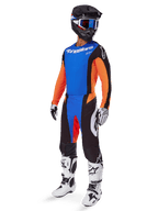 2025 Techstar Melt Gear Set, Complete Motocross Outfit, Blue Jersey with Orange Sleeves, Black Pants with Blue and Red Accents, Black Helmet with White and Blue Details, White Gloves and Boots with Black Patterns, Protective Racing Gear