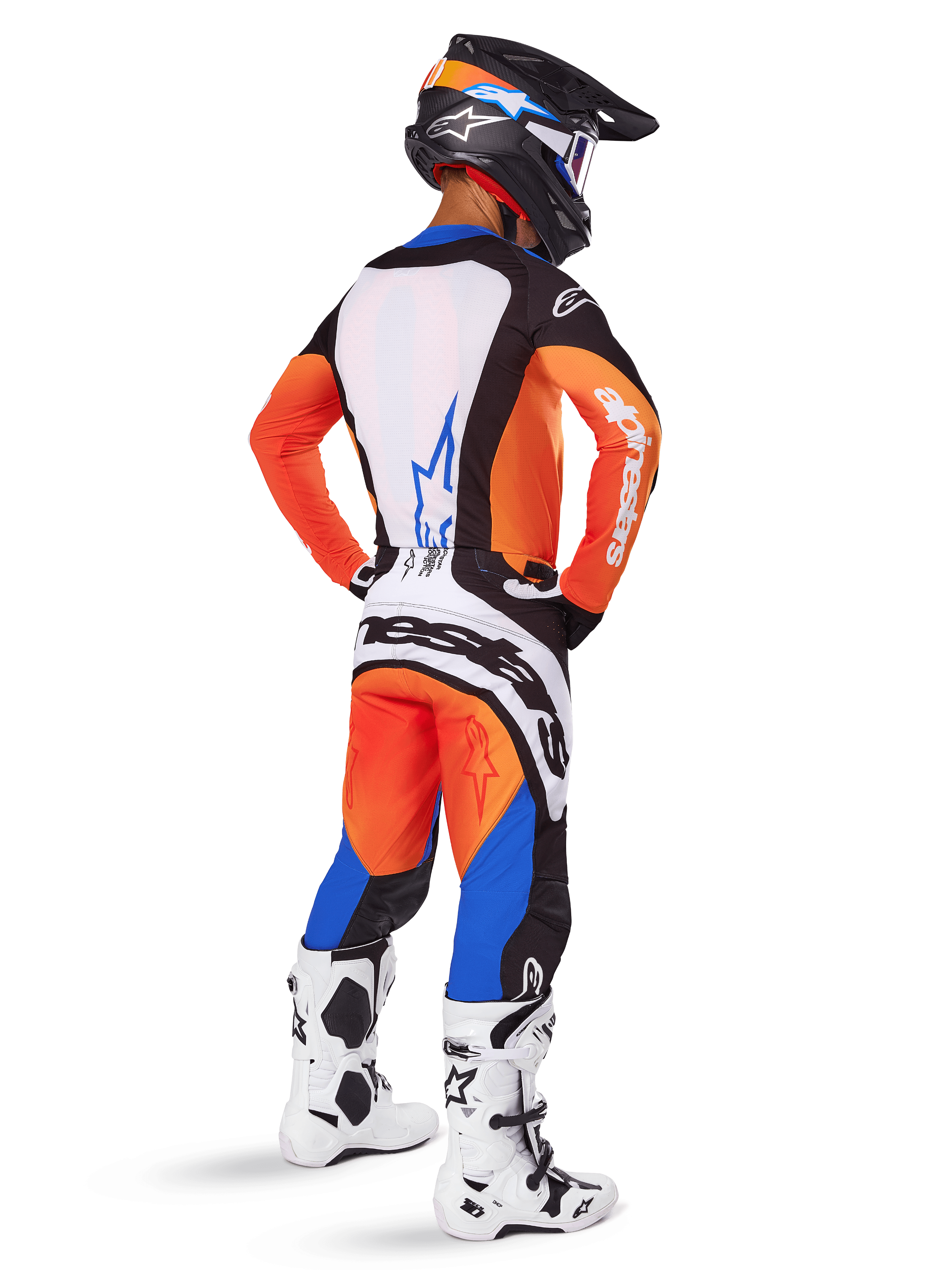 Motocross rider from a rear view wearing the 2025 Techstar Melt Gear Set, Orange and Blue jersey with white back panel and blue star logo, matching orange and blue pants with white Alpinestars branding, black helmet with blue graphics, and white motocross boots, coordinated off-road racing outfit.