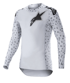 Alpinestars 2023 Supertech North Jersey, Motocross Jersey, Haze Gray and Black, white long-sleeve jersey with gray spotted pattern on sleeves and sides, black star logo on chest and shoulders, performance stretch mesh with curved hem