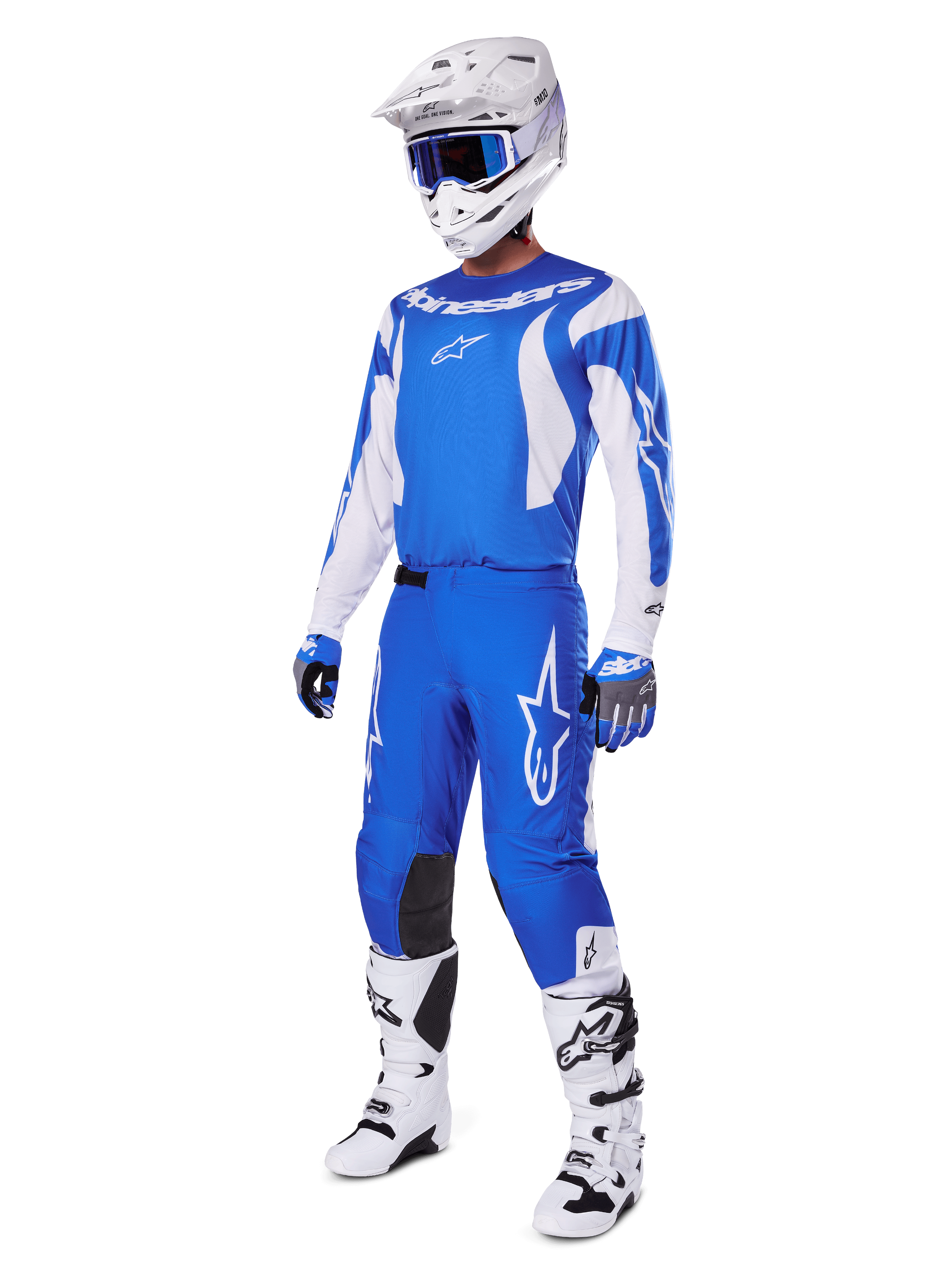 Motocross rider wearing the complete 2025 Fluid Haul Gear Set, Blue and White jersey and pants with Alpinestars branding, white helmet with blue goggles, white boots, and blue gloves, coordinated racing outfit for off-road motocross.