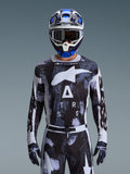 Alpinestars 2026 Racer Lahnd Jersey, Motocross Gear, Iron Camo pattern in Black and White, featuring a bold Star logo and ASTARS lettering, worn with matching pants and a blue motocross helmet