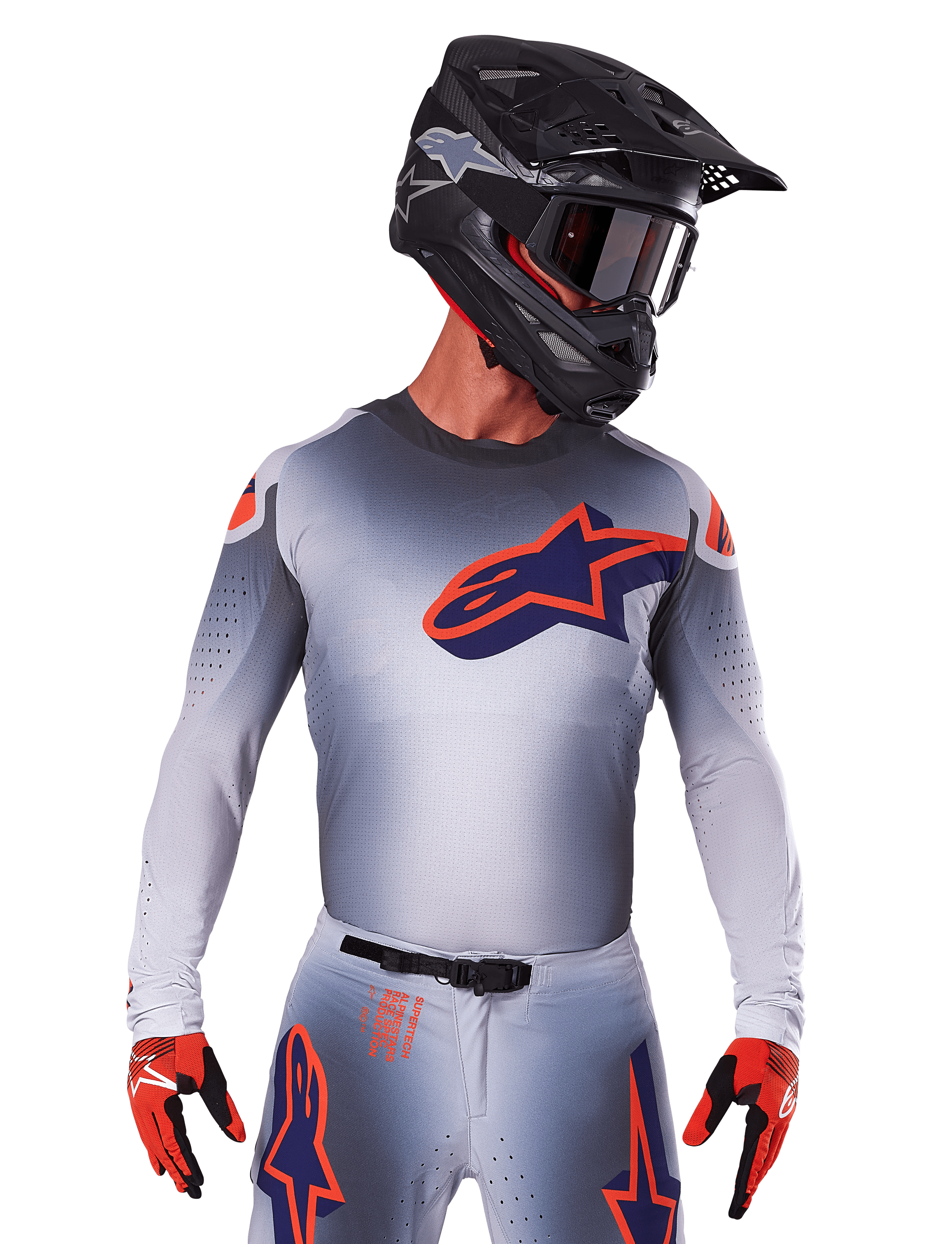 2025 Supertech Lipan Jersey, Motocross Racing Jersey, Gray with Orange and Navy Blue accents, long-sleeve performance top with perforated ventilation details, worn with black helmet and red gloves, sleek racing design