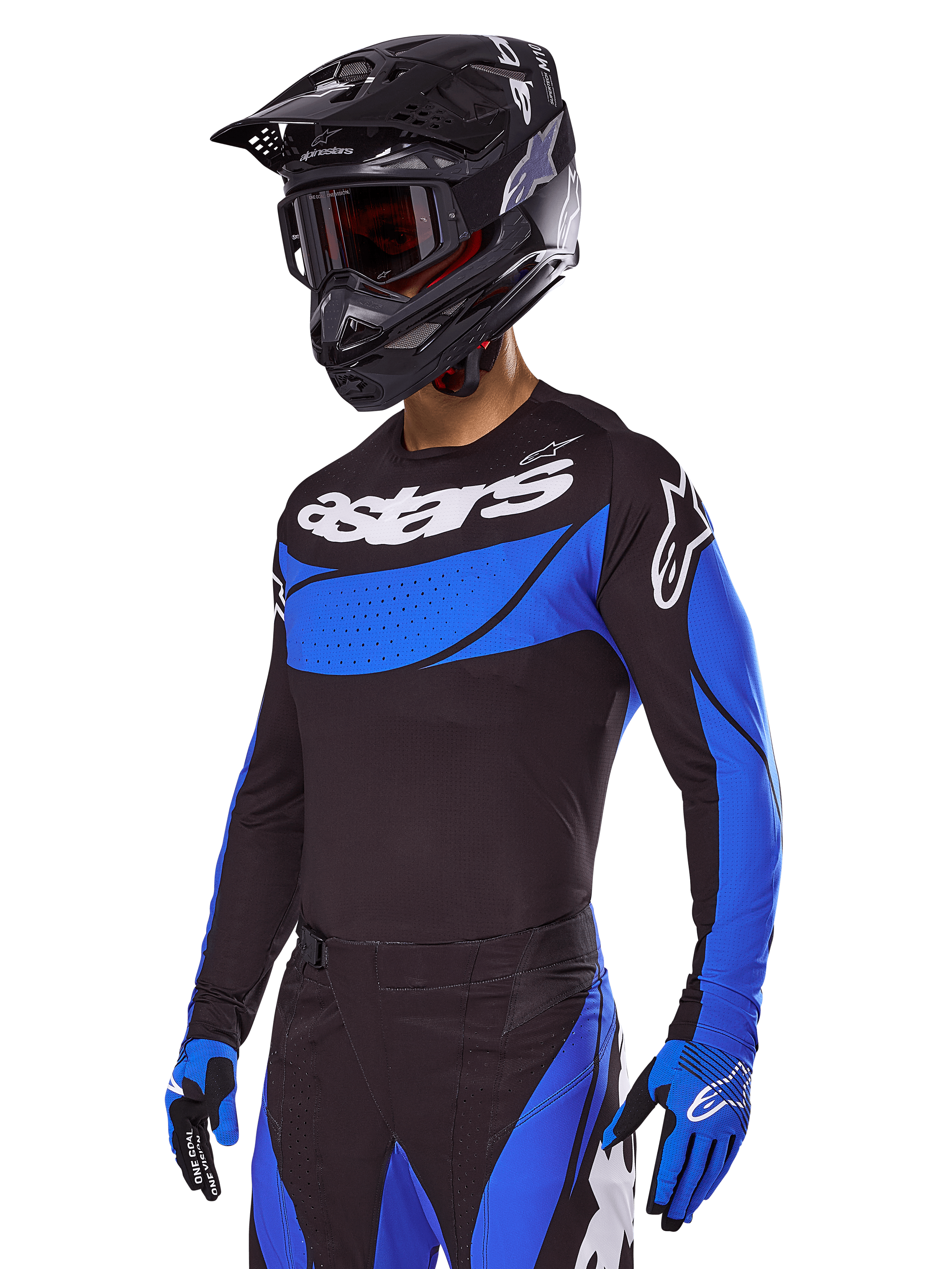 Motocross rider wearing the Alpinestars 2025 Techstar Dreem Gear Set, Black jersey with blue perforated-style panels and white branding, matching black and blue pants, black racing helmet, and blue gloves, coordinated performance outfit for off-road motocross.