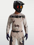 Alpinestars Racer Lone Jersey in Desert Camo and Black, men's motocross gear on model with helmet and goggles.