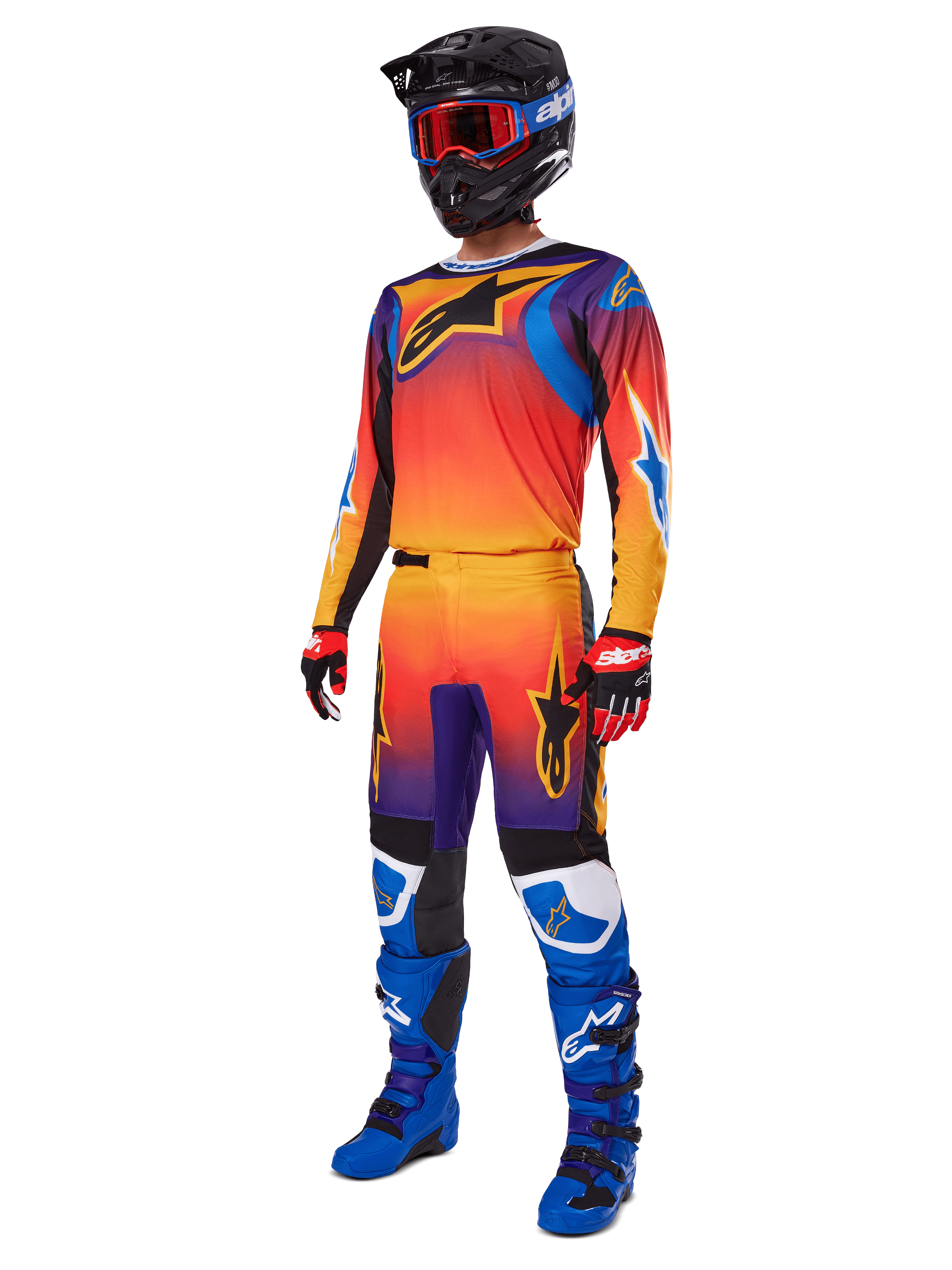2025 Fluid Wurx Gear Set, Motocross Jersey and Pants with Orange Red Purple gradient and Blue Yellow star designs, worn with a Black helmet, red goggles, Red and Black gloves, and Blue boots, high-visibility racing gear