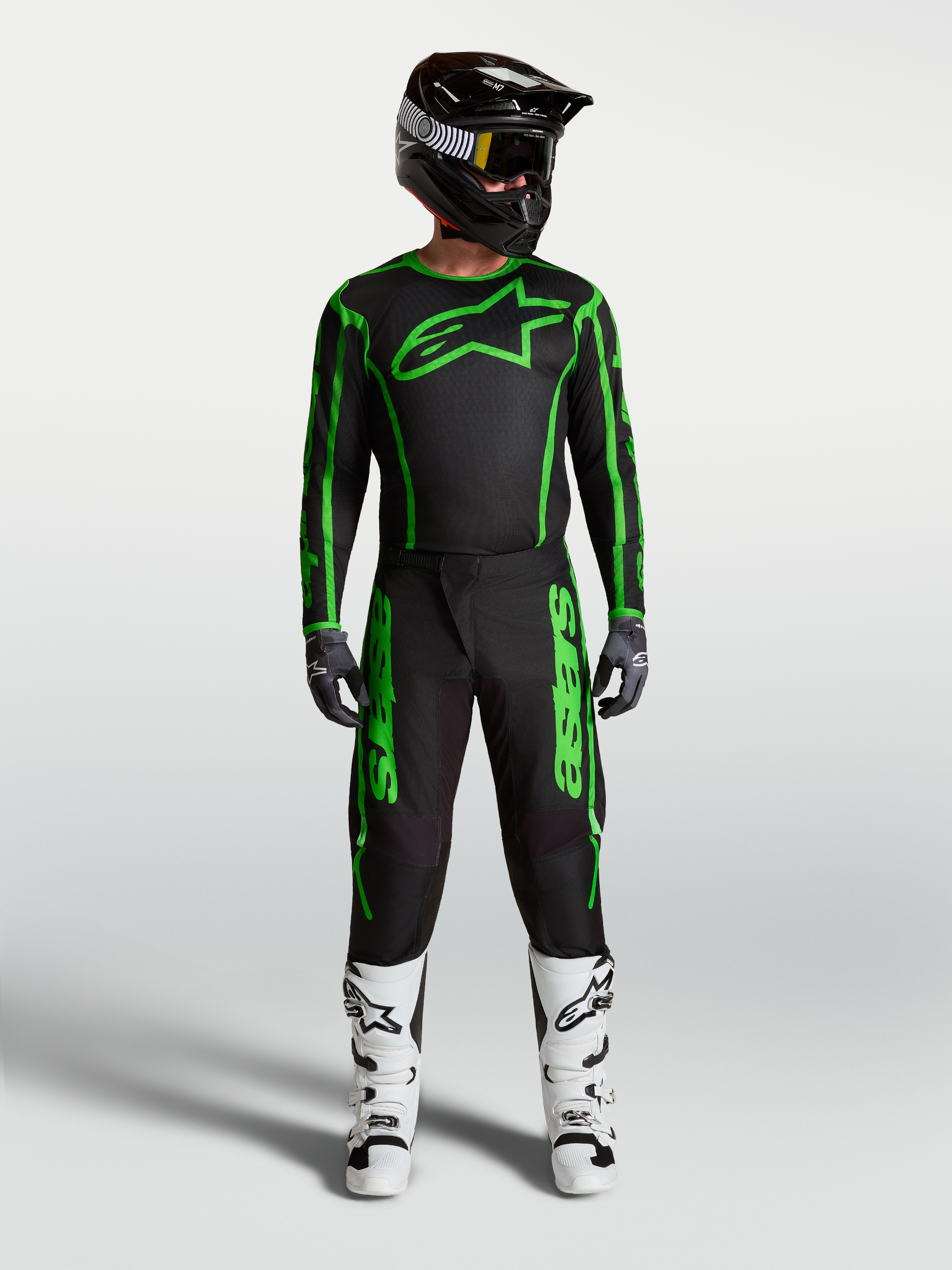 Alpinestars Fluid Apex V2 Jersey and Gear Set, Men's Black and Fluo Green Motocross Outfit with matching pants and white boots.
