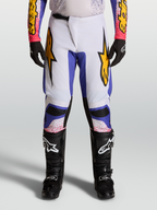 Alpinestars 2027 Fluid Drag Pants, men's motocross racing pants in light lilac and blue iris with gold accents.