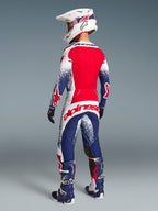 Alpinestars Limited Edition Techstar Unity Pants and Jersey, motocross gear in red, white, and blue, back view.