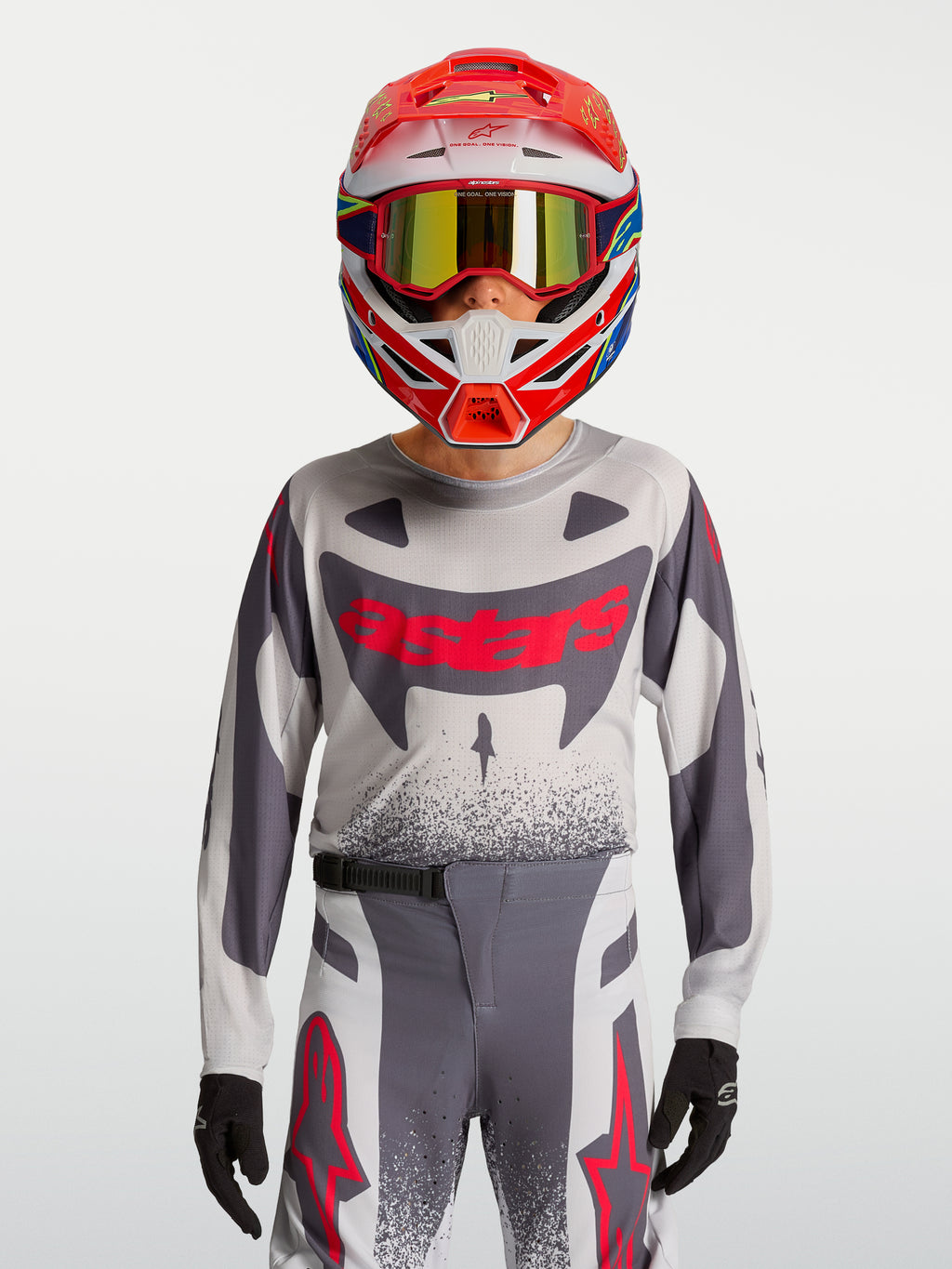 Alpinestars Youth Supertech Swan Jersey and Gear Set, gray and red fluo motocross outfit in breathable stretch mesh.