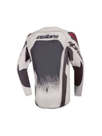 2027 Alpinestars Youth Supertech Swan Jersey, gray and dark gray youth motocross jersey with ventilated mesh and red accents.