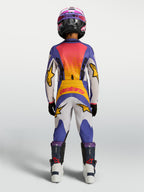 2027 Alpinestars Youth Fluid Drag Jersey and matching pants in blue and gold, youth motocross racing gear shown from the rear.