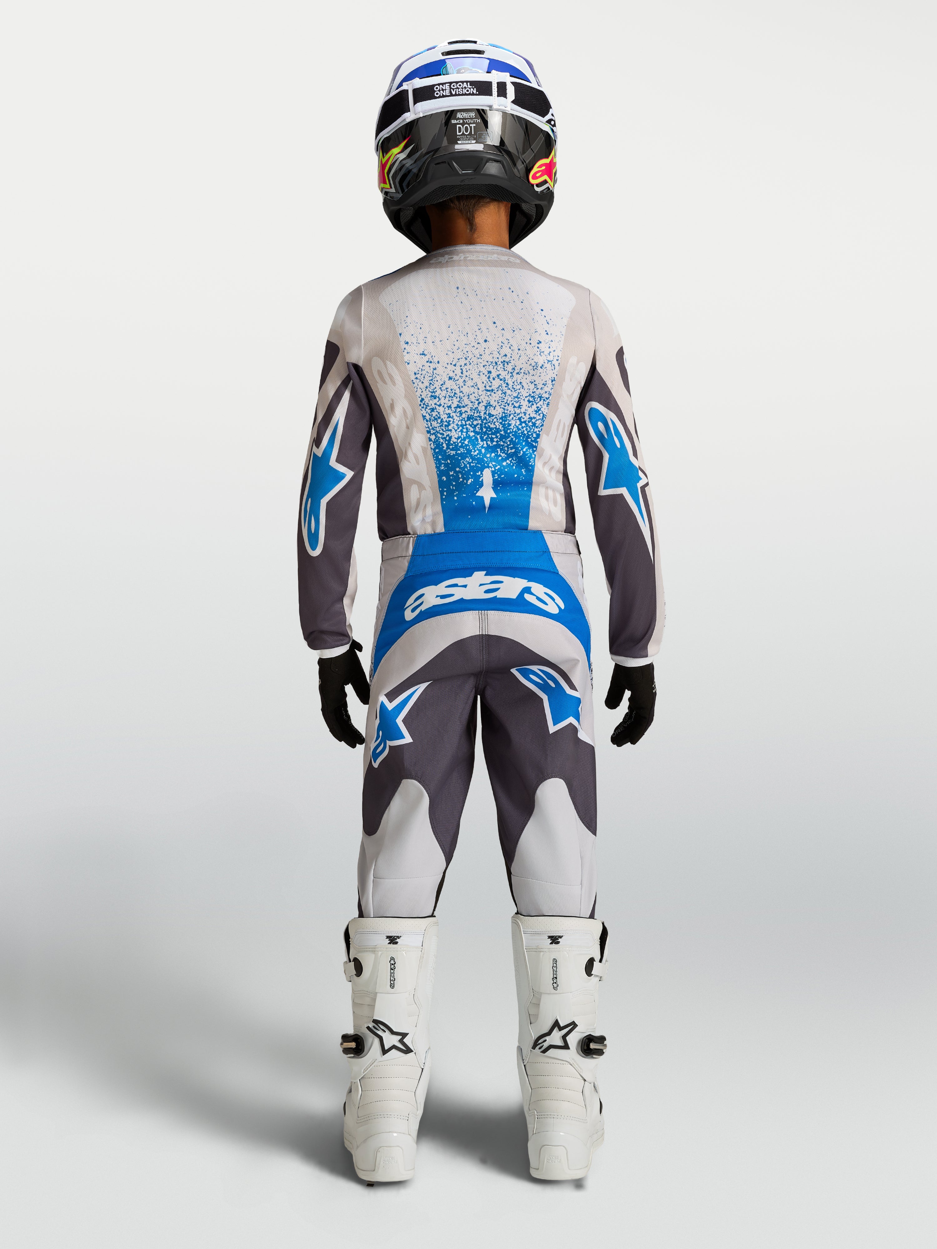 Alpinestars 2027 Youth Fluid Drag Gear Set, gray and blue breathable motocross outfit, textile construction, back view.