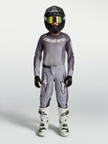 Alpinestars 2027 Youth Fluid Amber Jersey and Gear Set, gray and sand motocross outfit with black helmet and white boots.