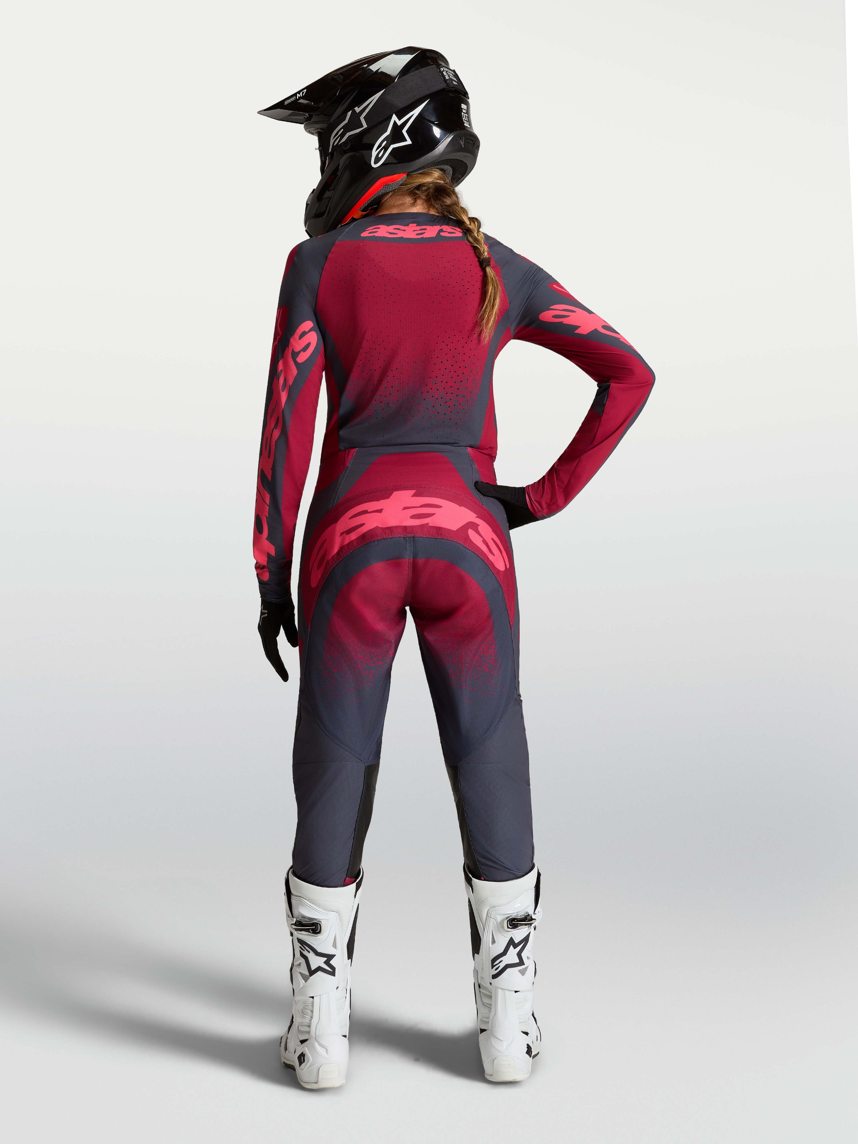 Alpinestars Stella Techstar Swan Gear Set AND Pants, women's motocross outfit in dark gray and crimson red, rear view.