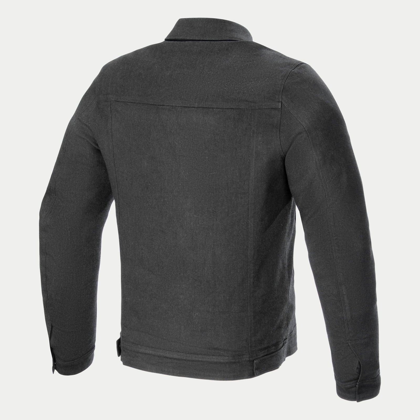 The Garage Jacket by Alpinestars EU is a long-sleeved, dark gray, urban-styled jacket with a collared neckline and four front pockets. Made from stretch cotton denim, it features a metallic zipper concealed under a flap and button closures on the pockets and wrists. A small tag is visible on the lower pocket.