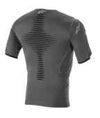 Alpinestars Roost Base Layer Top, Motocross Base Layer, Anthracite Black, back view featuring knitted breathable construction, textured central ventilation zone, short sleeves, and Alpinestars star logo on the collar and sleeve