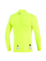 Alpinestars ZX Evo V3 Long Sleeve Top, Back View, Yellow Fluo, fluorescent yellow flame-resistant base layer with black star logo on upper back and certification labels at the hem, technical motorsport apparel