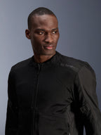 Alpinestars C-1 Air Jacket, Black, urban motorcycle jacket with tech mesh panels, worn by a model, featuring subtle heat-transfer Alpinestars logo on the shoulder, designed for airflow and lightweight comfort in warm weather