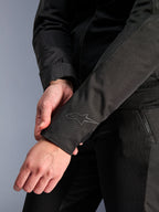 Alpinestars Stella C-1 Air Jacket, Black, close-up of the sleeve cuff featuring a subtle heat transfer logo, lightweight textile and mesh construction, urban motorcycle apparel for women