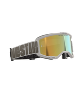 Alpinestars Vision 5 Hollow Goggles, Motocross Goggles, White frame with Wind Mirror Gold reflective lens, gray woven strap with bold Alpinestars typography, features "One Goal. One Vision." text on the lens, professional off-road racing eyewear