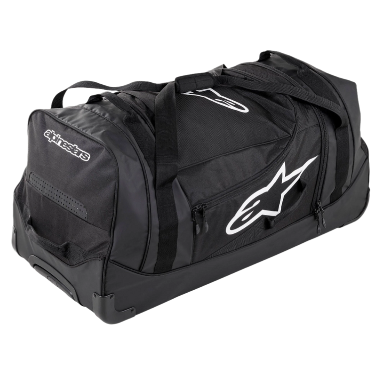 Alpinestars Komodo Travel Bag, large capacity gear bag, Black with white Alpinestars logos, featuring heavy-duty wheels, reinforced handles, and multiple zippered compartments for organized racing gear storage