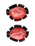 Alpinestars GP Tech Knee Sliders, Red and White, Motorcycle Racing Knee Protectors, featuring a large white star logo on glossy red plastic, 'ONE GOAL. ONE VISION.' text on black petal-shaped velcro backing, left and right pair for track use.
