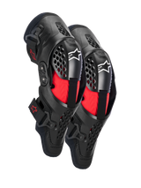 Alpinestars SX-1 Plasma Knee Protectors, Motocross Knee Protection, Black and Red, featuring semi-rigid ventilated frames, red inner padding, white Alpinestars logos on the kneecap, and a dual pivot hinge design for off-road performance