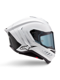 Alpinestars Supertech R10 Solid Helmet, White Glossy and Black Matt motorcycle racing helmet, side profile view, aerodynamic design with rear winglets and side vents, blue-tinted visor, featuring a black Alpinestars star logo on the side