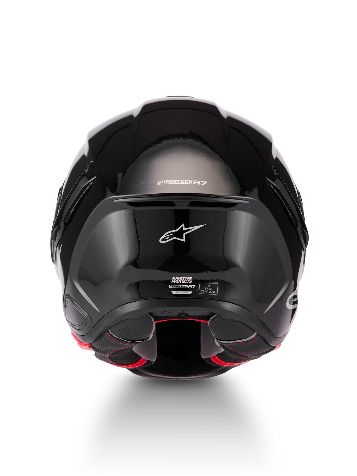 Alpinestars Supertech R7 Solid Helmet, glossy black motorcycle helmet, rear view showcasing aerodynamic carbon composite shell, white Alpinestars logo, and ECE 22.06 certification details