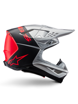 Alpinestars Supertech M10 Flood ECE 22.06 Helmet, Motocross Helmet, Silver Black and Orange Fluo, matte and glossy finish, aerodynamic profile with multi-composite shell, bold branding with orange Alpinestars logo, high-flow ventilation ports and protective visor