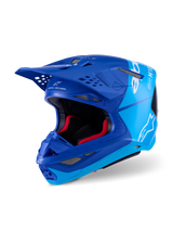 Alpinestars Supertech M10 Flood Helmet, Motocross Helmet, Metallic Blue and Medium Blue with Black Carbon Fiber accents, featuring white logos and M10 branding, multiple ventilation ports and red interior padding, designed for professional off-road performance.