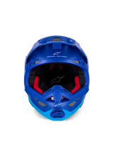 Alpinestars Supertech M10 Flood Helmet ECE, Motocross Helmet, Metallic and Medium Blue with black carbon accents, front-facing view showing chin bar and eye port, white Alpinestars logos and text, red interior padding, professional off-road protection
