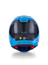 Alpinestars Supertech M10 Flood Helmet, Motocross Helmet, Metallic Blue and Medium Blue with Black Carbon Fiber, rear view showing 3K carbon texture, white star logos, MIPS sticker, and exhaust ventilation ports