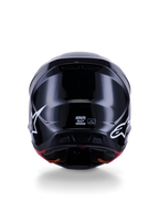 Alpinestars S-M7 Solid Helmet ECE 22.06, Motocross Helmet, Glossy Black, rear view featuring white star logos, aerodynamic composite shell with a high-shine finish, safety certification and size labels in the center