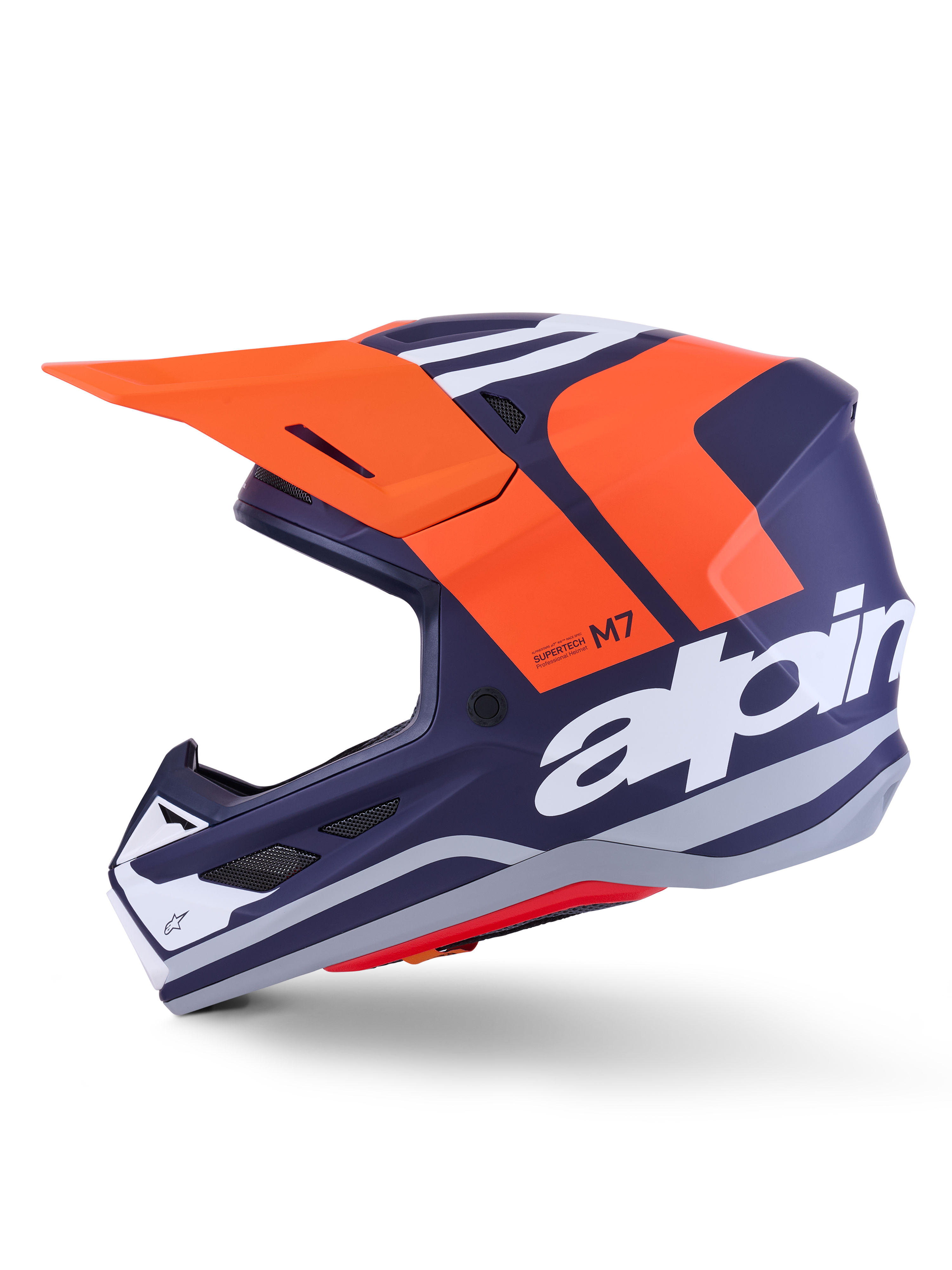 Alpinestars S-M7 Core Helmet ECE 22.06, side profile, navy blue and orange matte finish, large white branding on side, aerodynamic motocross helmet with protective visor
