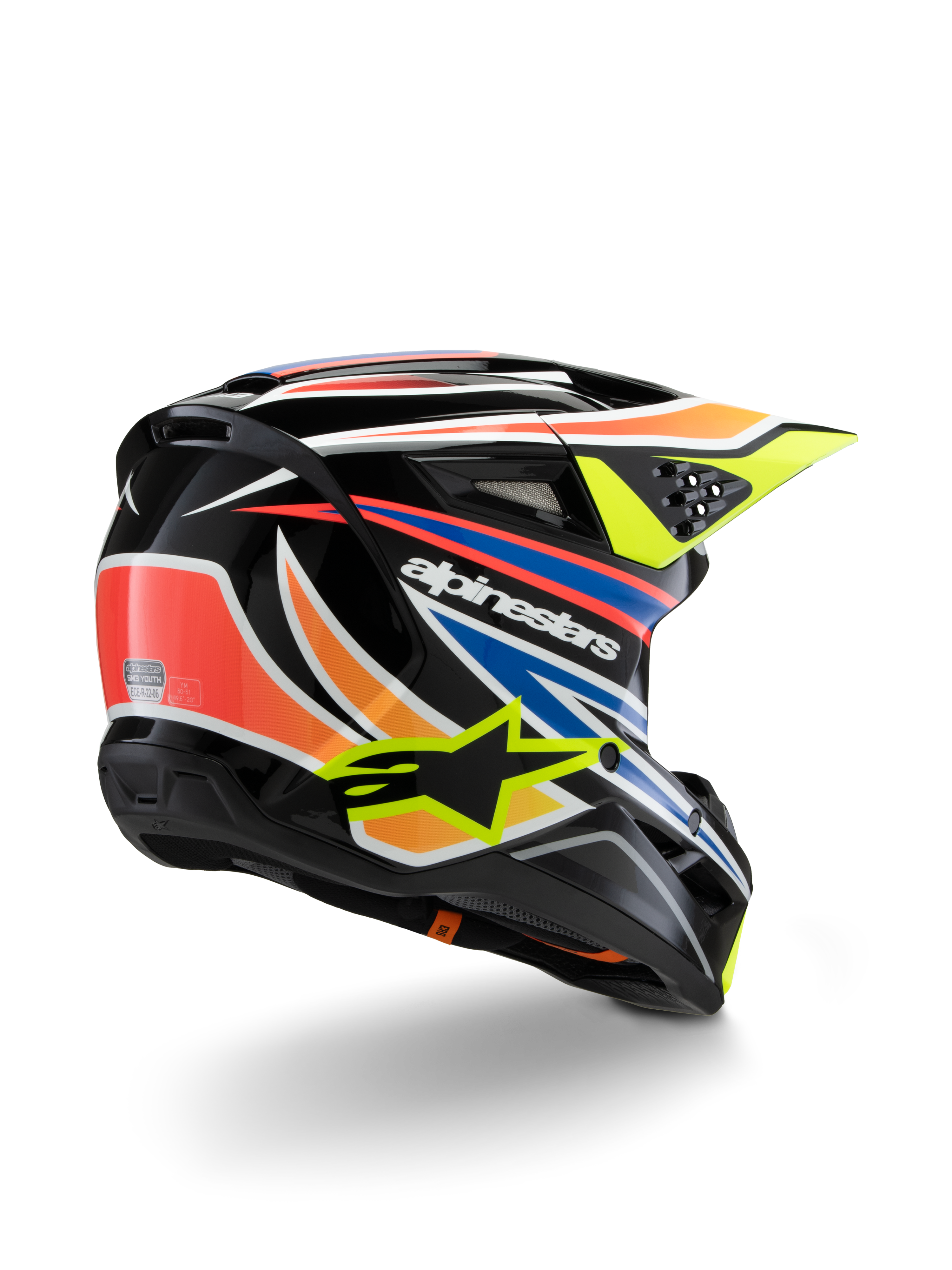 Alpinestars S-M3 Youth Wurx Helmet, Youth Motocross Helmet, Black with Vibrant Orange, Red, Blue, and Fluorescent Yellow Accents, rear three-quarter view showing aerodynamic shell and ventilation ports, glossy finish with bold Alpinestars branding.