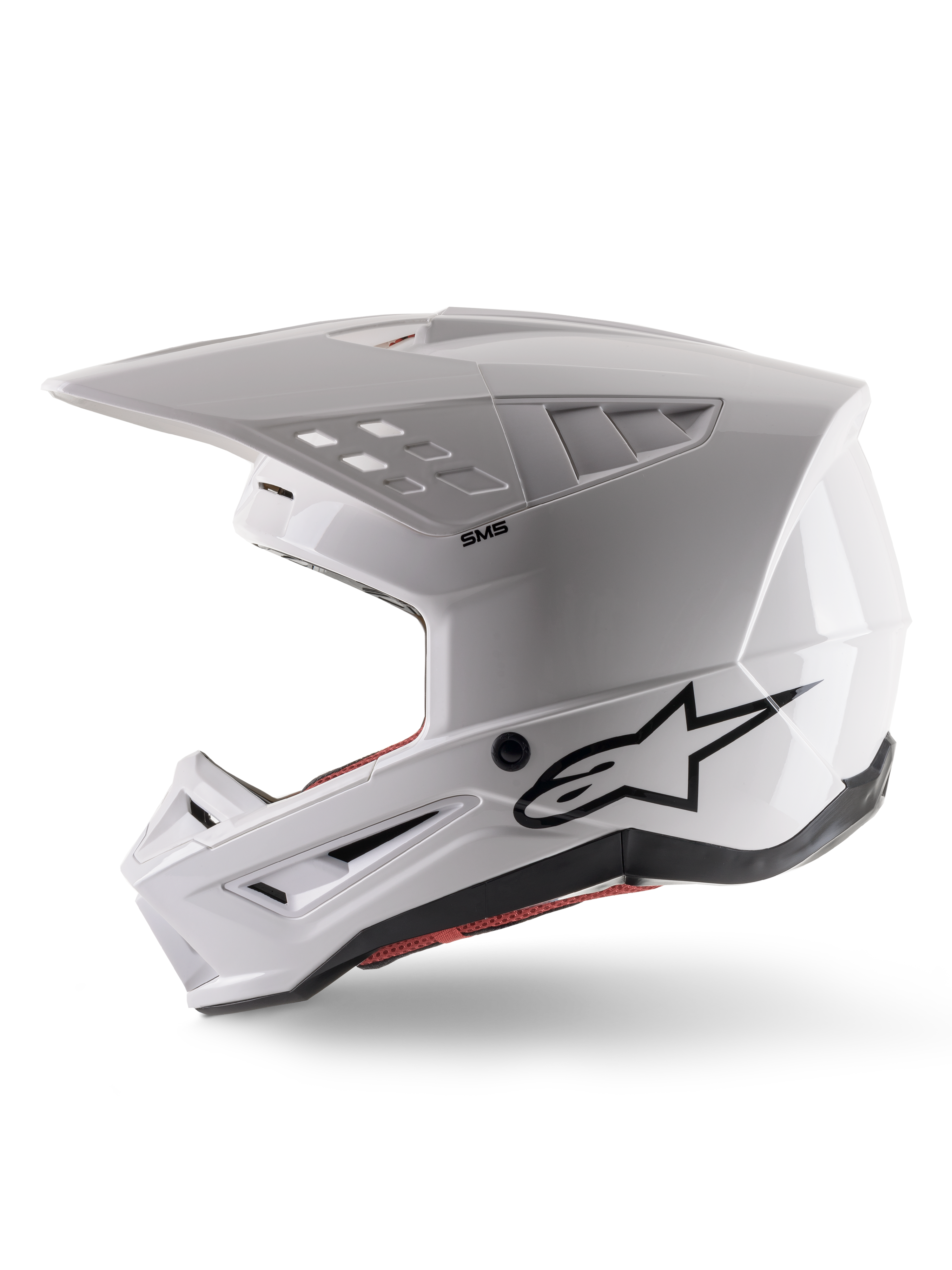 Alpinestars S-M5 Solid Helmet ECE 22.06, Motocross Helmet, White Glossy, side profile view with angular shell design, black Alpinestars logo on the side, multiple ventilation ports, and integrated visor for off-road racing.