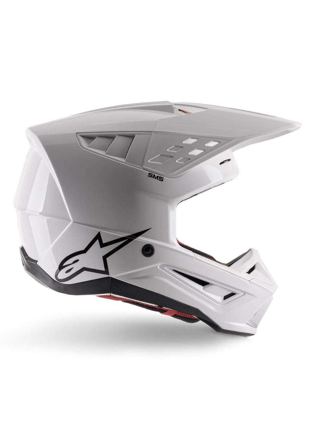 Alpinestars S-M5 Solid Helmet ECE 22.06, Motocross Helmet, White Glossy, side profile featuring an angular aerodynamic design, prominent peak visor, integrated air vents, black Astars logo on the rear, and visible red interior padding