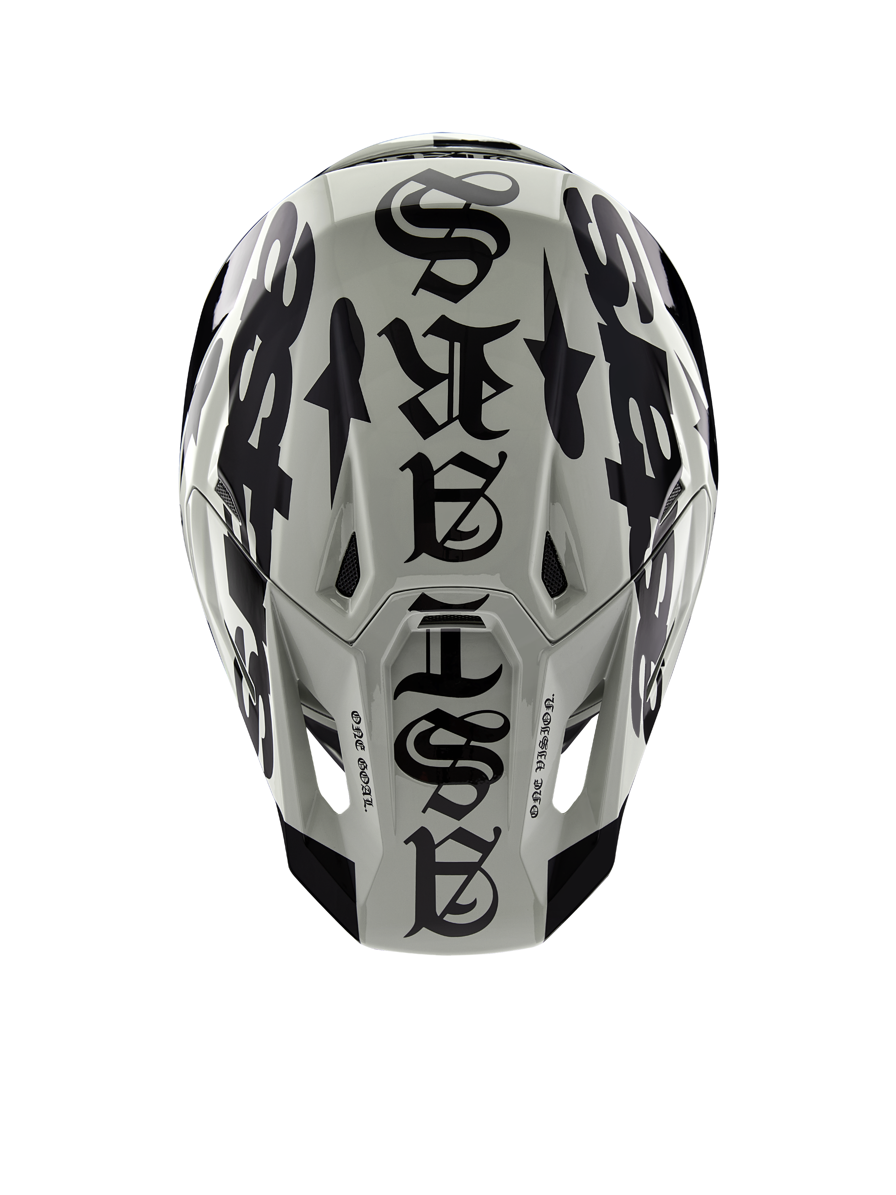 Alpinestars Limited Edition S-M7 Wolf Dust Helmet, top view, Dune and Black glossy finish, featuring bold gothic-style typography across the crown and One Goal One Vision detailing, professional motocross racing head protection