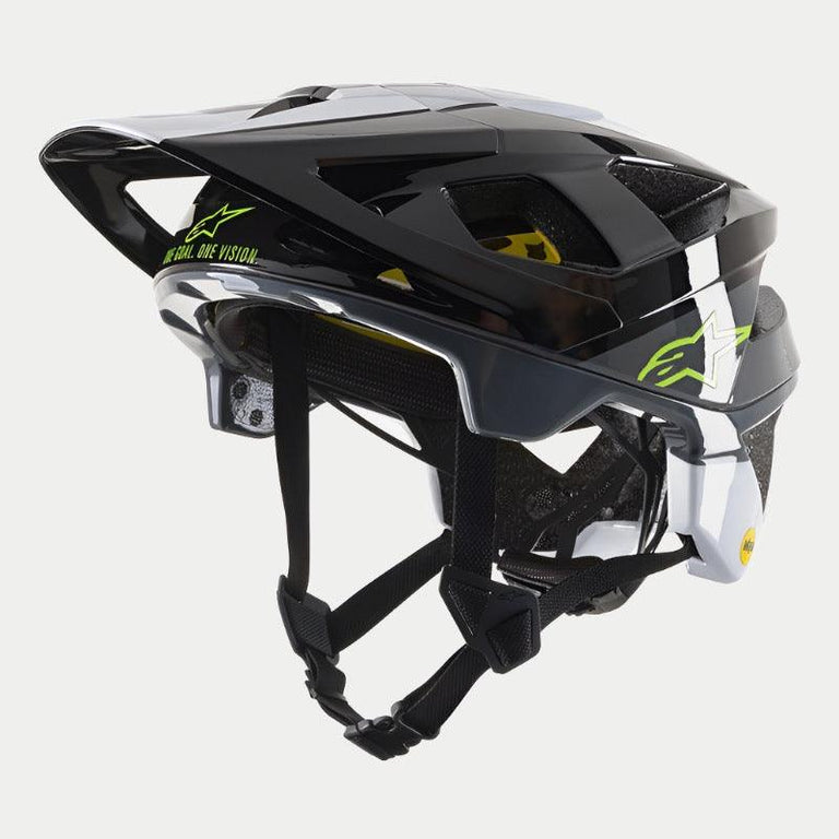 The Vector Tech Pilot Helmet CE, crafted by Alpinestars EU, boasts a sleek multicolored design featuring black, yellow fluo, and red glossy sections. The helmet is designed with ventilation openings and an adjustable strap system to ensure rider protection. Enhanced safety is provided through MIPS technology, while the brand name "Alpinestars" is prominently displayed on the side. The background is white.