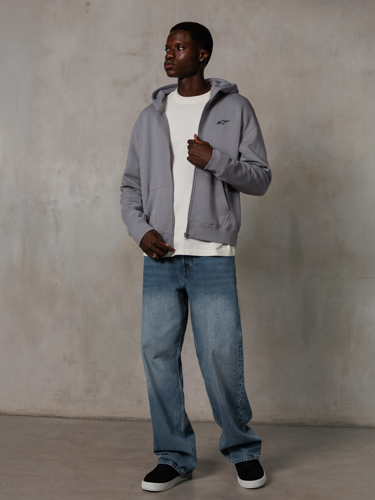 Alpinestars Essentials Ageless Zip Hoodie, Silver, casual streetwear, full-zip fleece hoodie with a small black logo on the chest, worn by a model with a white t-shirt and blue jeans, relaxed lifestyle fit