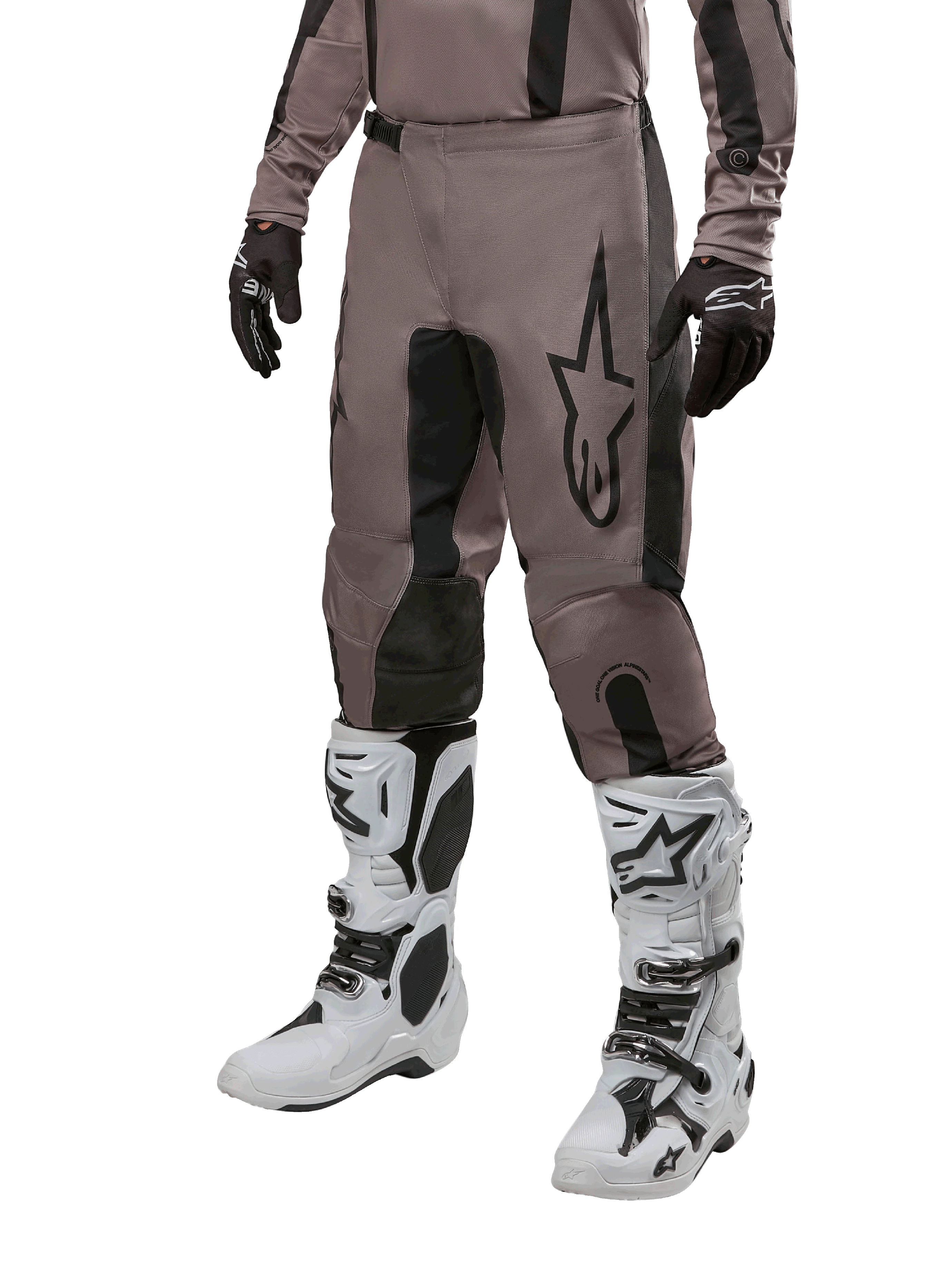 Alpinestars 2024 Fluid Lurv Pants, Motocross Pants, Mud Black and Black, featuring Alpinestars logo, worn with black gloves and white motocross boots, sporty design for off-road racing