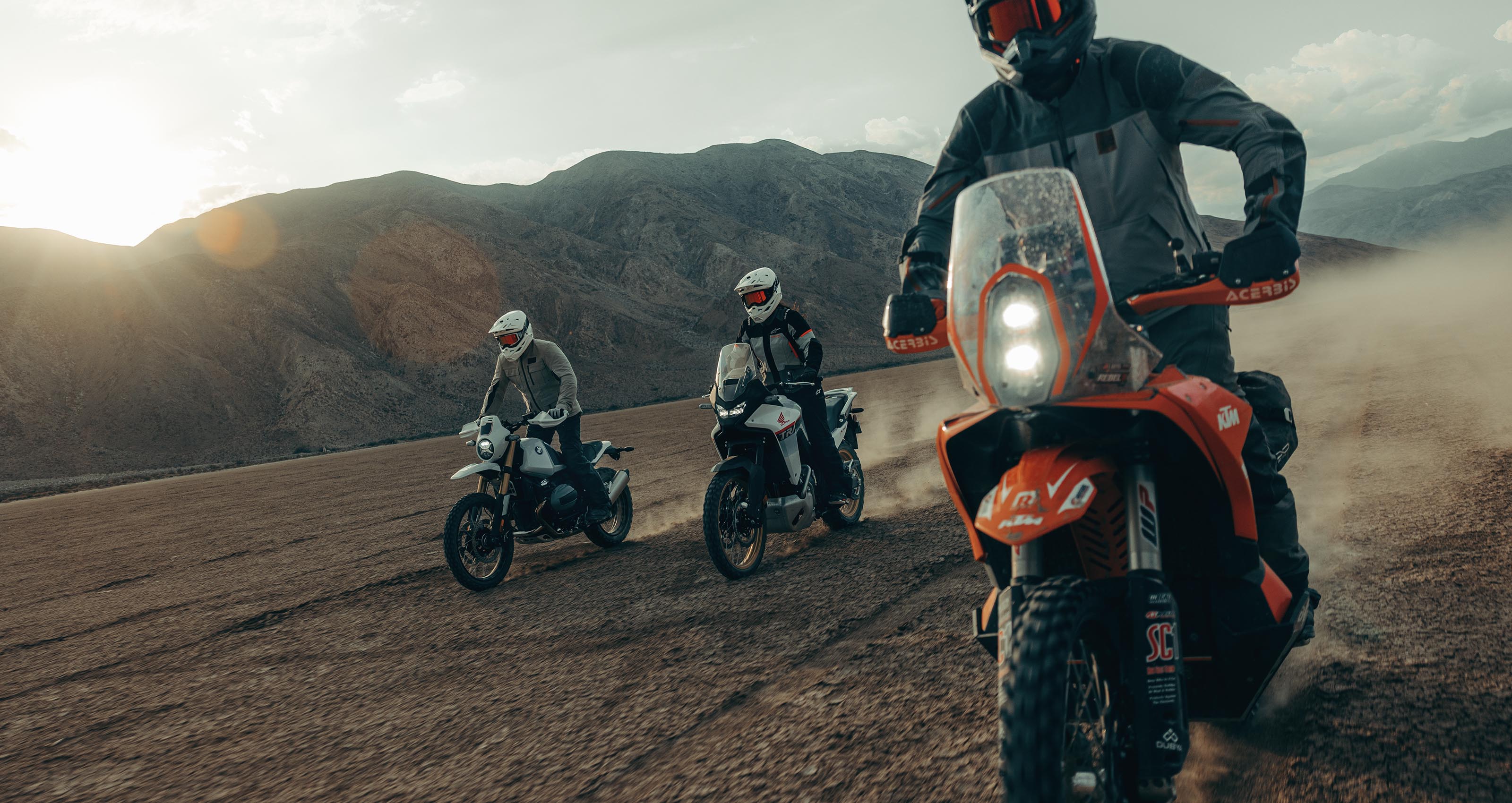 Alpinestars Stella Andes V4 Drystar Jacket and Pants, Women's Adventure gear, Black and Gray, motorcycle riding in the desert.