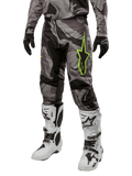 Alpinestars 2024 Racer Tactical Pants, Motocross Pants, Gray and Black Camouflage, lime green star logo, worn with white and black boots and black gloves, off-road riding gear