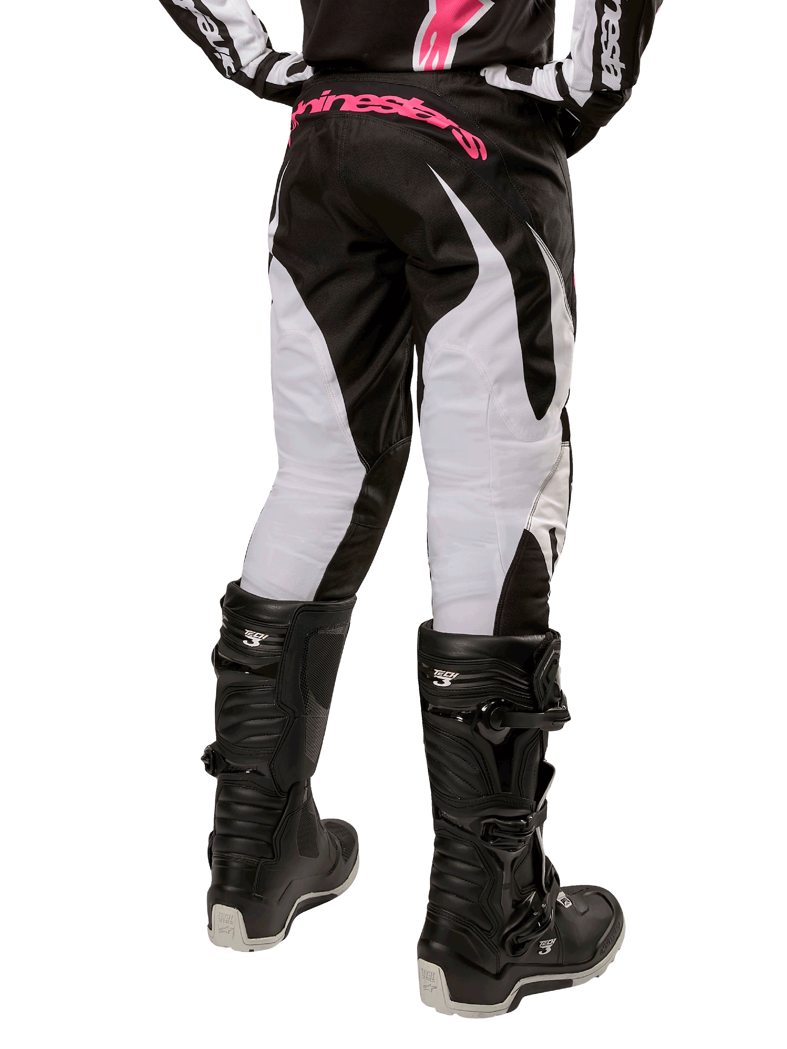 Alpinestars Women Stella 2024 Fluid Pant, Motocross Pants, Black and White, back view showing white leg panels and pink branding on waistband, worn with black Tech 3 boots, durable gear for off-road racing